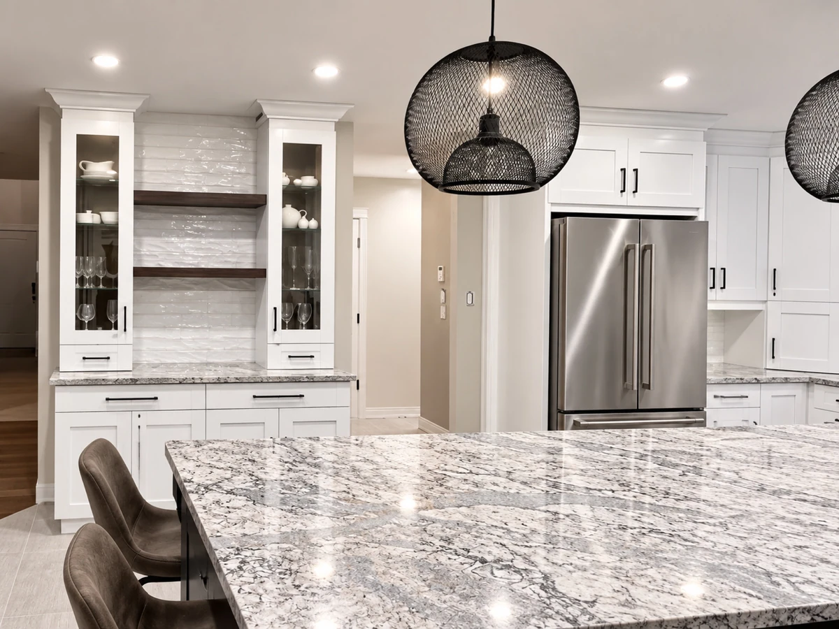Custom kitchen millwork with display cabinetry and pendant lighting